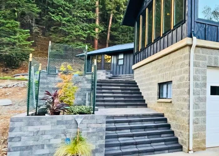 concrete steps with a retaining wall in the backyard